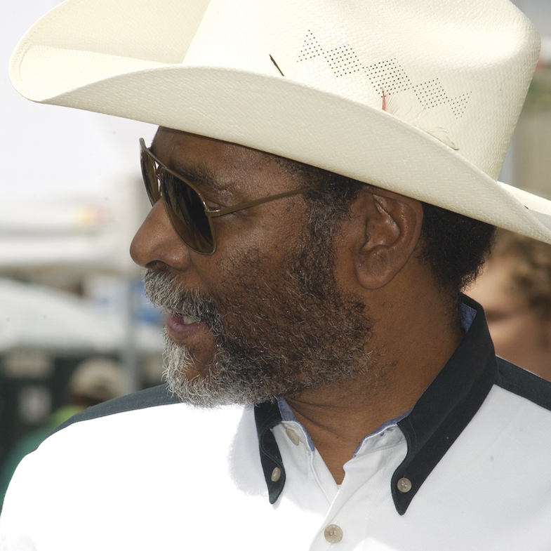 Man in white cowboy hat.