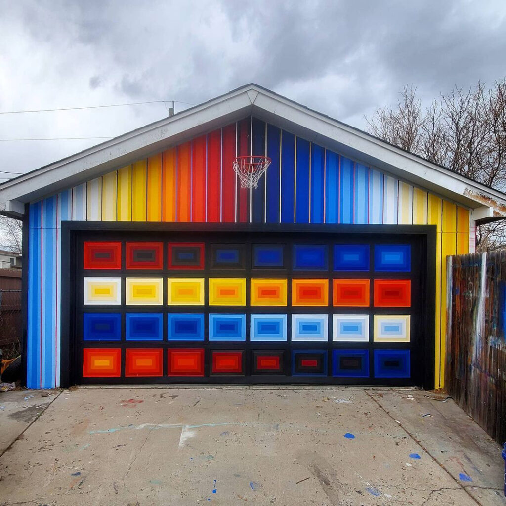 Garage painted in shades of red, blue, and yellow.