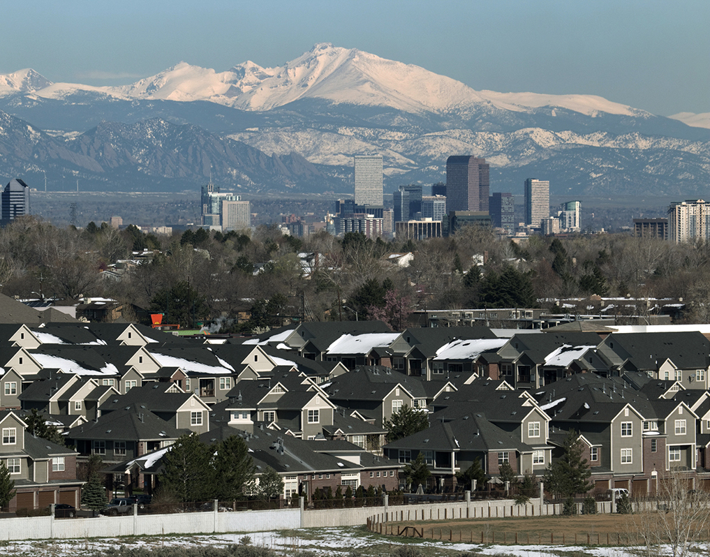 Denver skyline with mountains in the background.