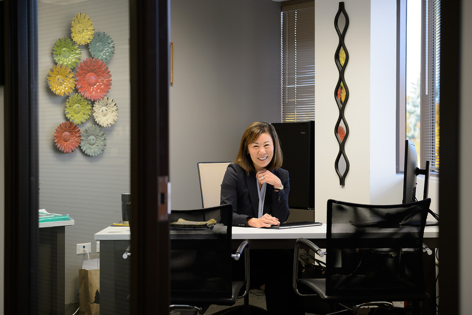 A person sits at a desk in an office.