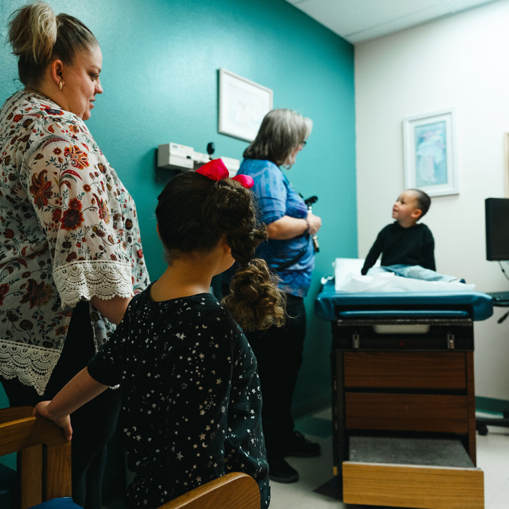A family in an exam room.